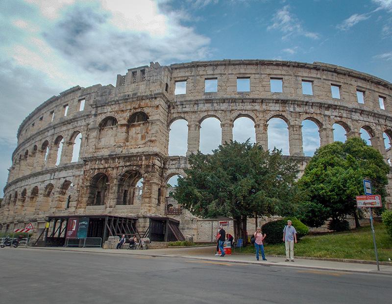 The impressive Pula Arena, a well-preserved Roman amphitheater in Istria, Croatia, often visited on cross-border self-guided cycling tours from Slovenia.