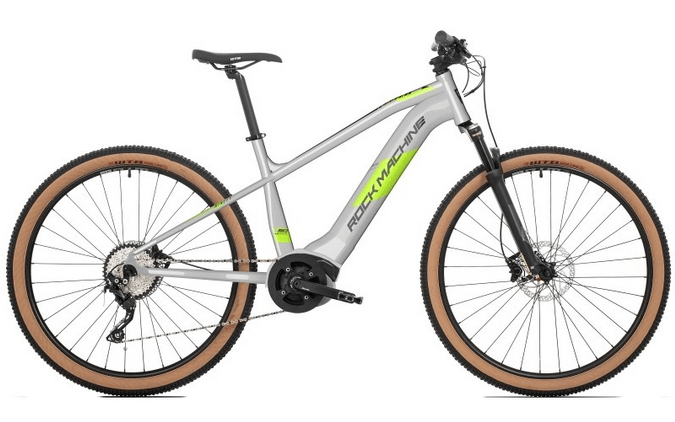 Light gray and neon green Rock Machine electric mountain bike (e-bike), ideal for rent on demanding Helia self-guided cycling tours in Slovenia.