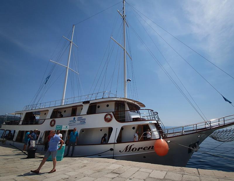Tour boat Moren at harbor Croatian Adriatic coast cycling and sailing holiday