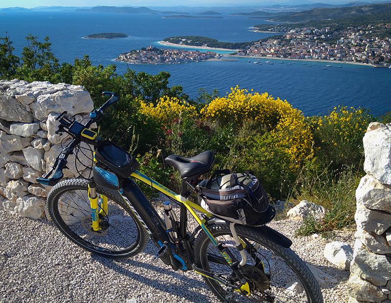 E-bike parked at scenic overlook Croatian Adriatic coastal town islands cycling